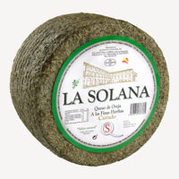 Queso artesano premiado con finas hierbas - corte y presentación